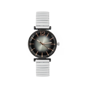 Detail of white elastic stretch band and black gradient dial on women's quartz watch