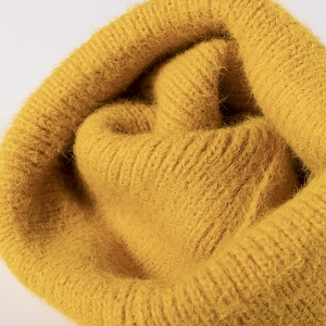 Warm yellow knit beanie for women in soft mohair texture and stylish minimalist design