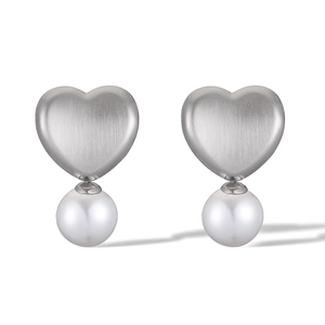 Detail showing brushed silver heart studs with elegant white round pearls on white background