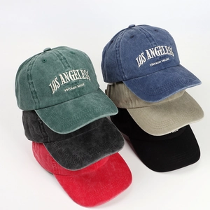 Close-up of vintage washed baseball caps with Los Angeles embroidery in multiple colors