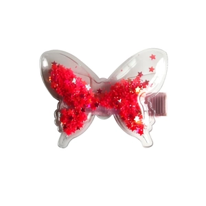 Fermaglio per capelli a farfalla per bambine con paillettes rosse e base in tessuto