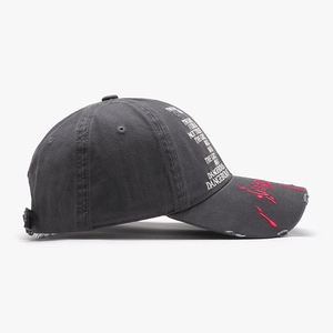 Charcoal grey washed cotton baseball cap with red embroidery and distressed detailing