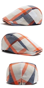 Detail view of plaid flat cap showing breathable fabric and metal adjustment buckles
