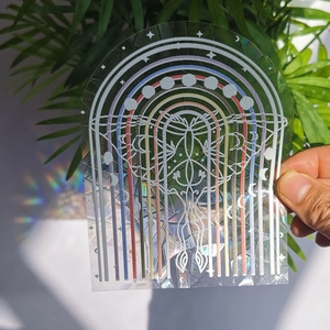 Holographic arch suncatcher window decal showing moon phases and rainbow light effect