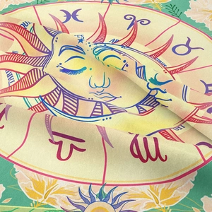 Macro detail of sun god tapestry showing fabric texture and zodiac signs like Pisces