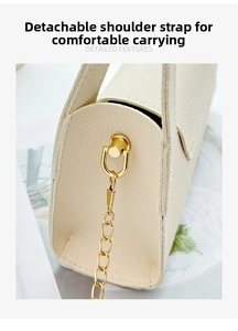 Macro detail of creamy lychee texture bag with gold metal clasp and detachable chain strap