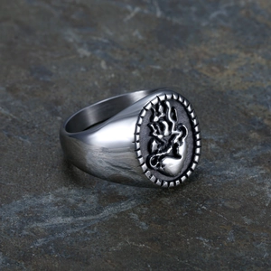 Detailed relief of a heart in flames on a vintage gothic stainless steel ring for men