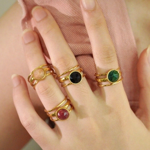 Stack of 14k gold plated stainless steel rings with colorful natural stone gemstones