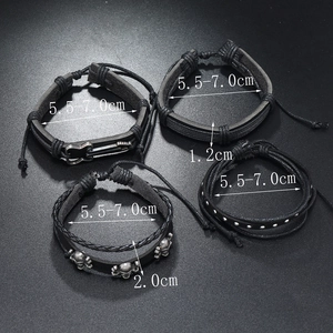 Detail view of black leather men's bracelets showing size 5.5-7.0cm and guitar skull charms
