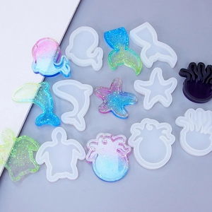 Marine animal silicone resin molds set including whale and dolphin shapes with pink glitter