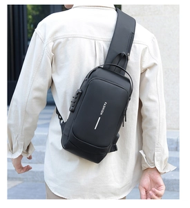 Detail view of the secure anti-theft combination lock on a black nylon crossbody bag