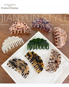 Close-up of acetic acid hair claws in assorted patterns like tortoiseshell and marble