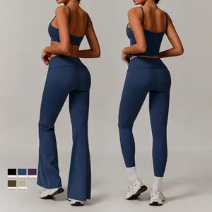 Women recycled yoga set featuring cross-back sports bra and flare pants in navy blue