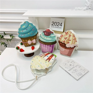 Cartoon cupcake crossbody bags in blue and green with slender leather straps for women
