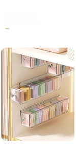 Close-up of a wall-mounted transparent storage drawer for organizing socks and underwear