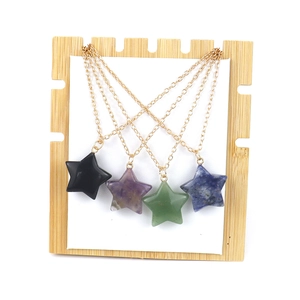 Star-shaped natural stone pendant necklace set with obsidian and amethyst on gold chain
