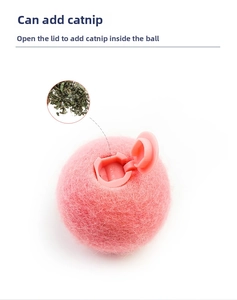 Detail showing the refillable opening of the pink cat toy ball for adding catnip
