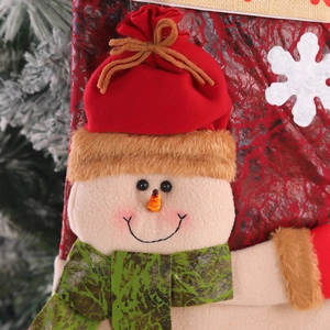 Calza di Natale sacchetto regalo con simpatico pupazzo di neve e fiocchi di neve