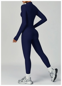 Detail of navy ribbed yoga set with long sleeve crop top and high waist leggings