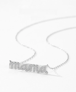 Detailed macro view of S925 sterling silver mama necklace pendant with sparkling zircon pavé