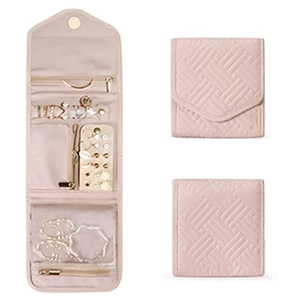 Pink quilted jewelry roll organizer featuring necklace hooks and transparent zip pockets
