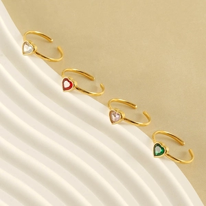 Set of four adjustable gold-plated rings with colorful heart-shaped crystal gemstones
