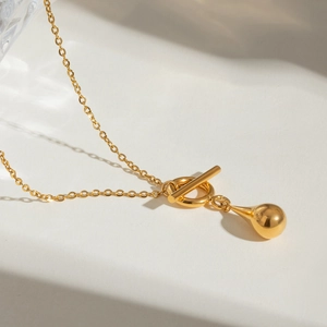 Elegant gold stainless steel OT buckle necklace with polished water drop pendant
