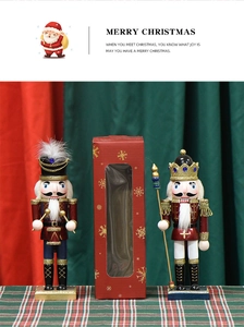 Close-up of 25cm pearlescent pink nutcracker soldiers in a festive red gift box set