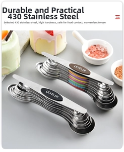 Macro shot of double-headed magnetic stainless steel measuring spoons with leveler tool