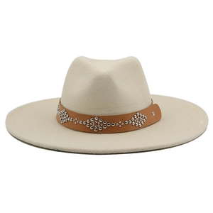 Detail of light beige fedora wool hat with studded brown leather band decoration