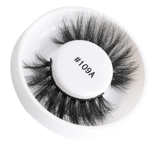 Detailed view of model #109A dense voluminous false eyelashes in a white storage box