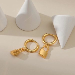 Elegant 18K gold-plated hoop earrings with lock pendants on a minimalist background