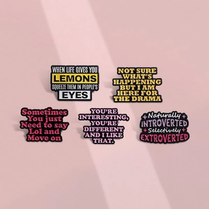 Five unique enamel pins featuring motivational English quotes on minimalist metal badges