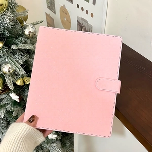 Close-up of pink glitter PU leather binder cover with snap button for photo cards