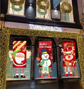 Detail of Santa, Snowman and Reindeer hanging banners for festive wall decoration
