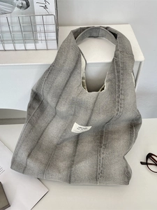 Tie-dye grey denim canvas tote bag with wide shoulder strap and vintage fabric label