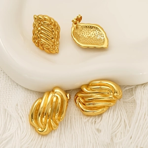 Vintage woven gold earrings set with leaf texture and irregular liquid metal designs