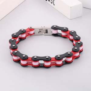 Detail of red and black bicycle chain bracelet made of stainless steel for men