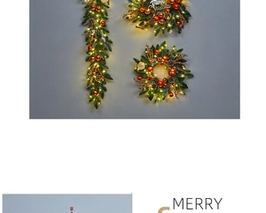 Detail of Christmas wreath set with LED lights, red baubles, and Merry Christmas sign