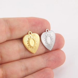 Pendentifs cœur classiques en acier titane or et argent avec texture rayons de soleil