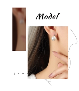 Detailansicht eines eleganten Perlenohrrings mit kleinem glitzerndem Diamanten am Model
