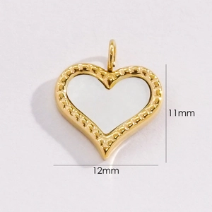 Detail of a 12mm x 11mm 14K gold-plated heart pendant with white shell inlay