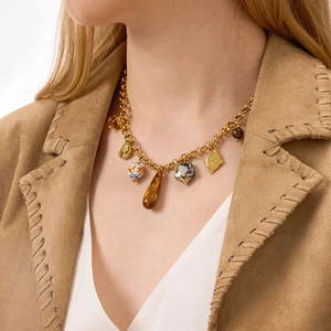 Titanium steel multi-pendant necklace with resin and ceramic charms on a gold chain