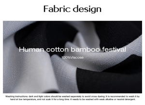 Close-up of black and white 100% Viscose fabric texture with washing instructions