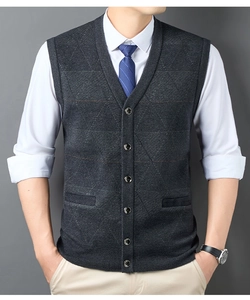 Detail of grey V-neck knitted vest showing button closure and diamond weave pattern