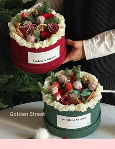 Detail of red and green knit texture Christmas flower boxes with festive decorations