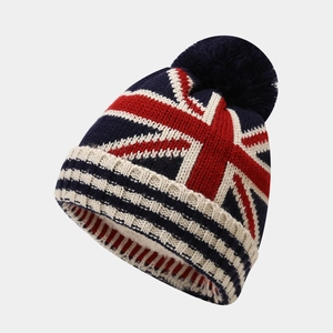 Kids navy knit beanie with UK flag pattern and pompom for winter warmth