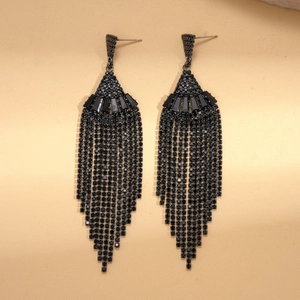 Detailed view of black fan-shaped tassel earrings with cubic zirconia and silver needles