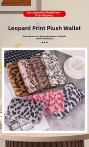 Macro shot of assorted leopard print plush pouches with smooth metal zippers