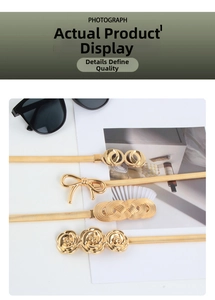 Detailed view of four golden elastic metal chain belts with various stylish buckle designs